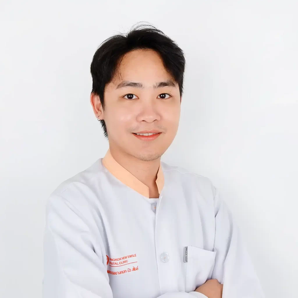 An image of a male dentist smiling